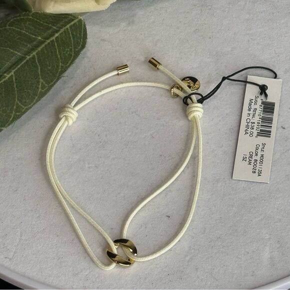 Marc By Marc Jacobs Cream String Bracelet With Gold Tone TurnLock Charm - Picture 5 of 5